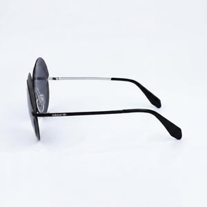adidas Originals Contemporaneo Round Sunglasses Women — side view, Non-Polarized Black lens