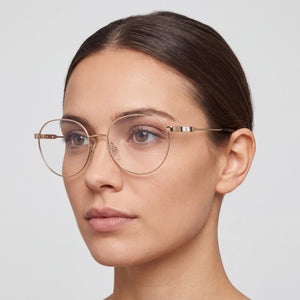 Carolina Herrera Her 0121 Round Eyeglasses Women — side view, Gold Metal temples