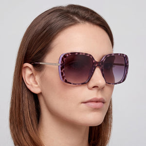 Guess GU778083Z60 Purple Sunglasses Women — lifestyle wear, city streets and open-air cafes
