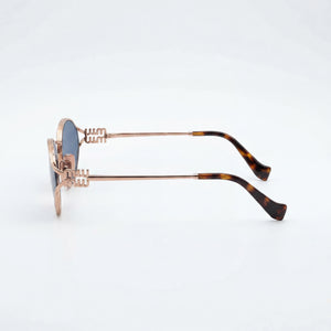 Miu Miu Modern Oval Sunglasses Women — side view, Non-Polarized Grey Gradient lens