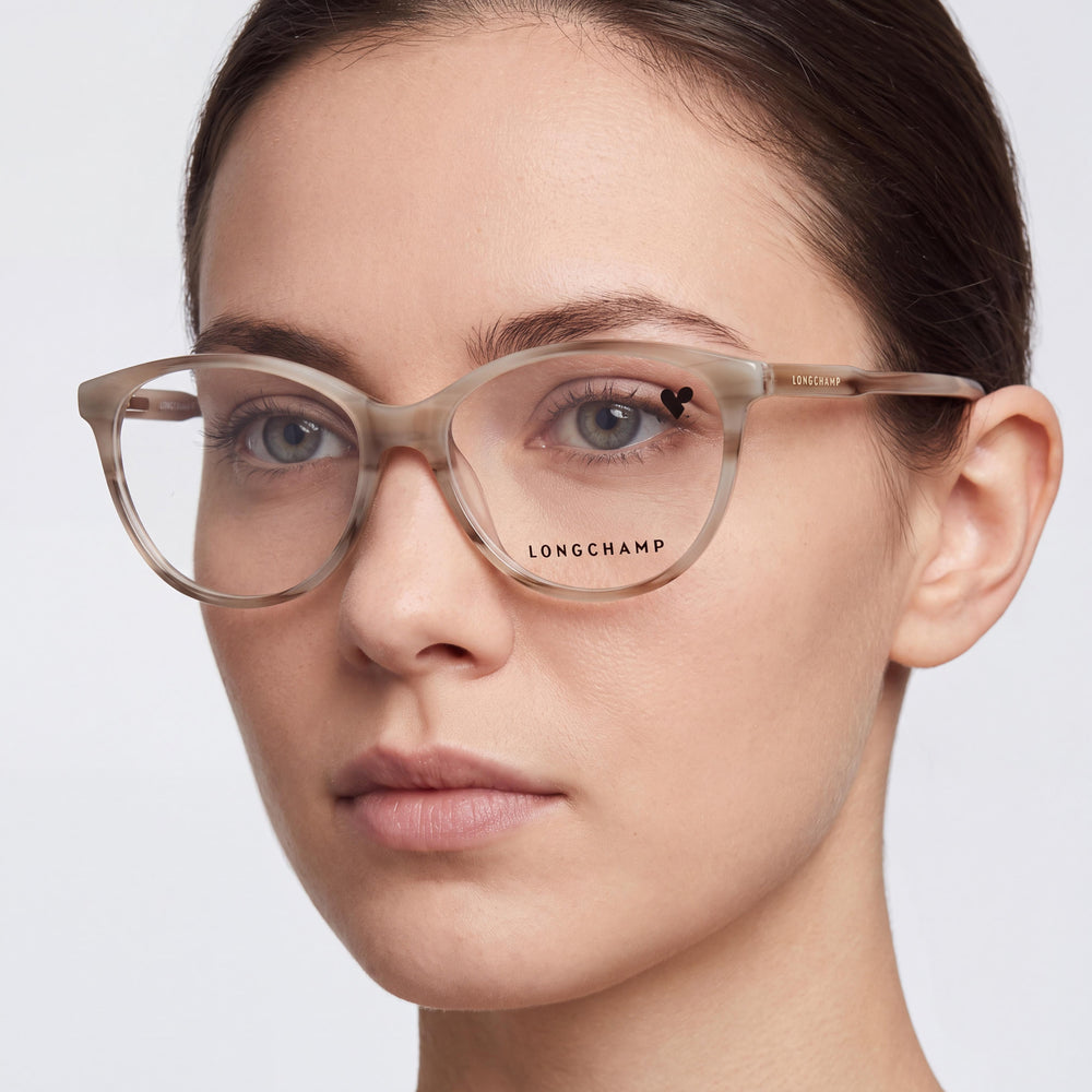 Longchamp LO2709 Oval Eyeglasses Unisex — side view, Clear Polycarbonate temples
