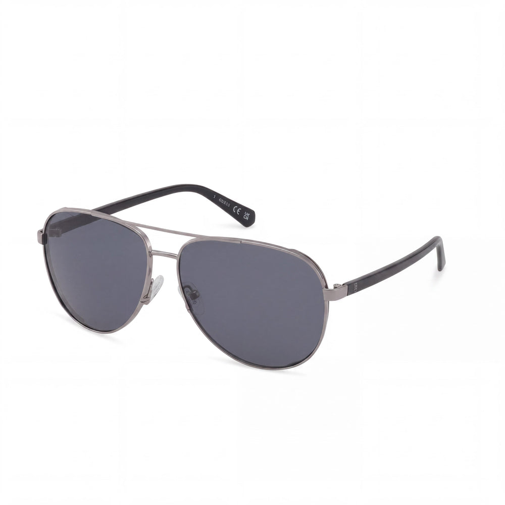 GUESS GU00140 Gafas de sol piloto con montura de metal brillante color plomo, lentes ahumadas con 100% protección UV 61mm