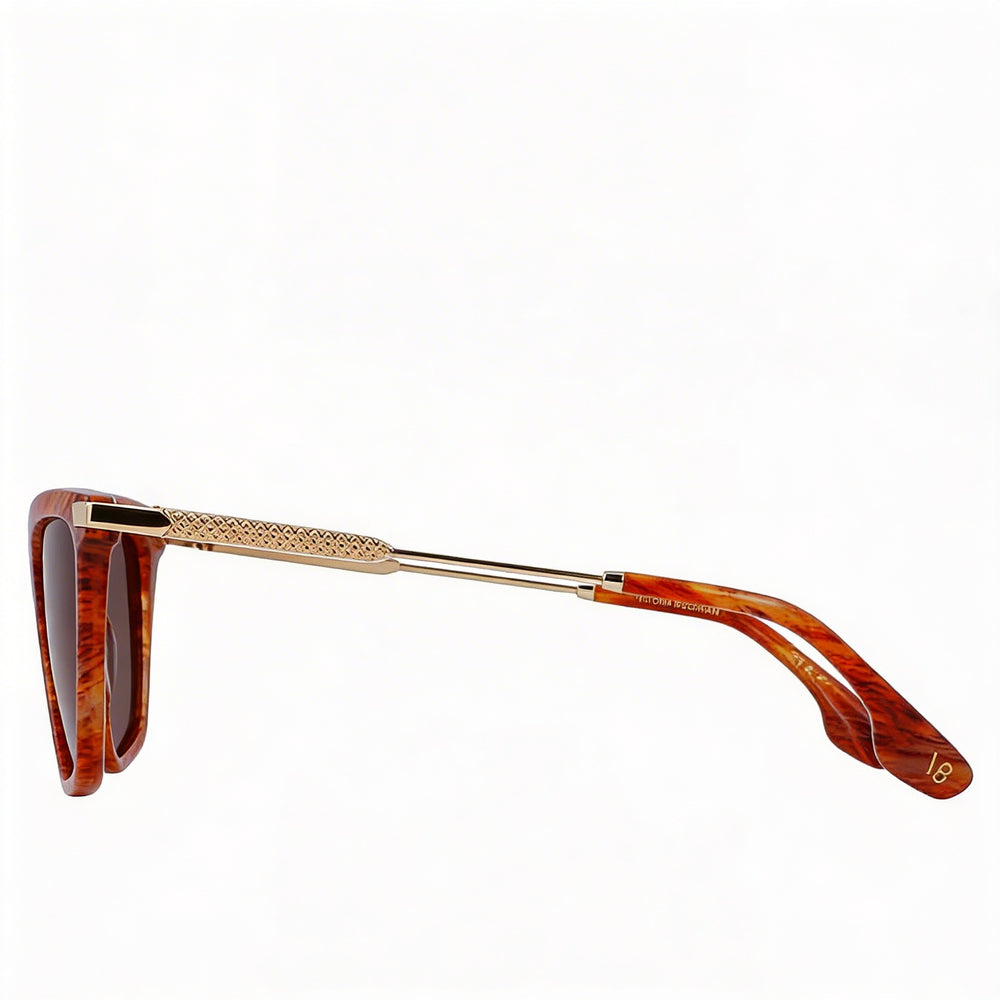 Gafas de sol modernas Victoria Beckham para mujer con montura de acetato en color ámbar y lentes de policarbonato de 57 mm.
