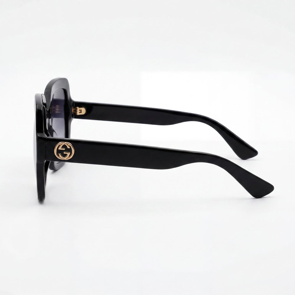 Gucci Gg0036sn-001 Gafas de sol para mujer con armazón de plástico negro, lentes grises degradadas y protección UV, 54 mm