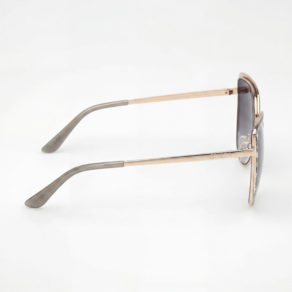 GUESS GU00217 Gafas de sol de metal casuales para mujer con protección UV 400 no polarizadas, montura oro pálido, lentes ahumadas degradadas 59mm
