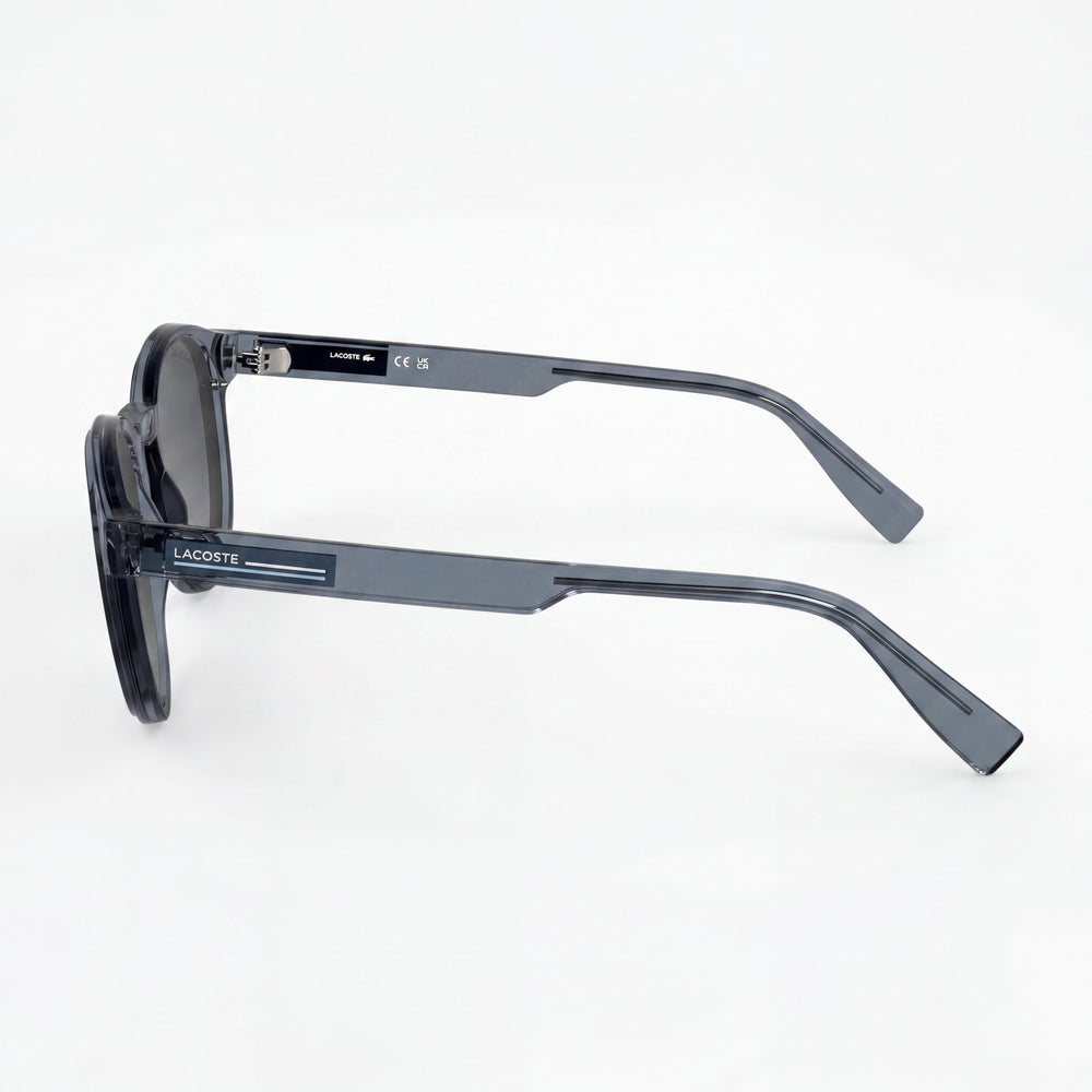 Gafas de sol piloto Lacoste Classic para hombre, con montura de plástico transparente gris claro y lentes de policarbonato grises, 51 mm
