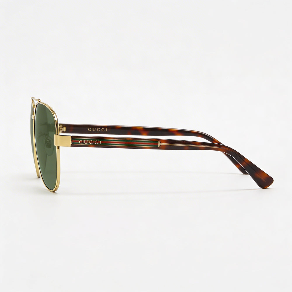 Gafas de sol unisex Gucci Aviators de plástico con protección UV, montura dorada, lentes verdes, ancho de lente de 63 mm.