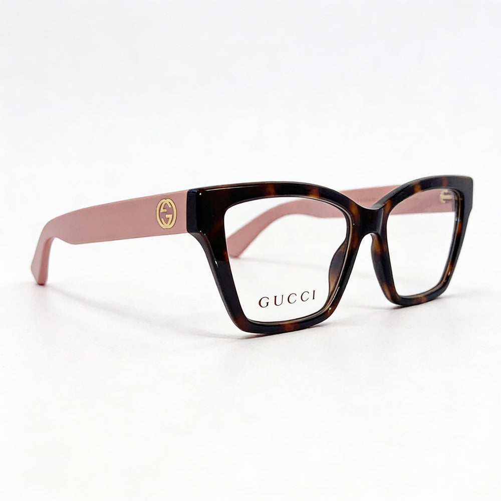 Montura de gafas Gucci rectangular de acetato color carey para mujer con logotipo GG entrelazado en rosa habano transparente