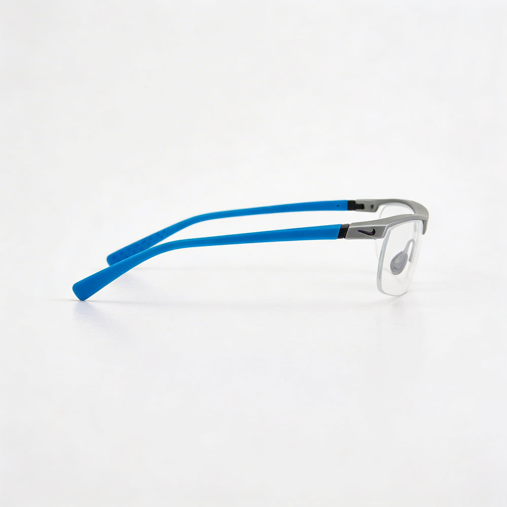 Nike 7071/2 Gafas sin montura de plástico plateado mate y azul claro para hombre con lentes de demostración transparentes de 57 mm