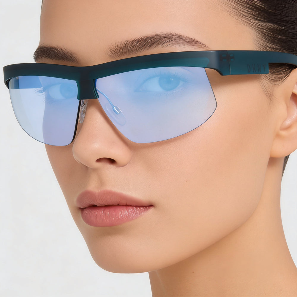 Gafas de sol DKNY Dk515s para mujer con montura rectangular de plástico en color verde azulado y lentes de acetato de espejo azul.