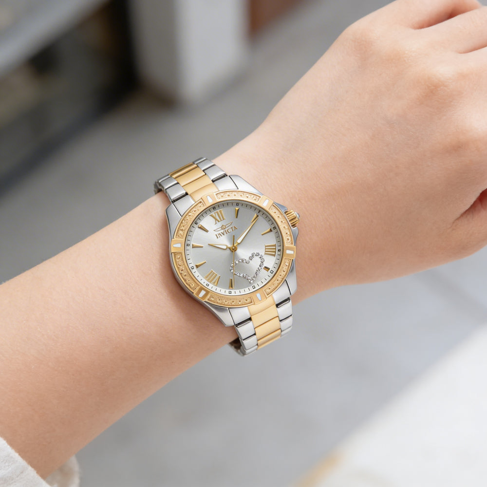 Reloj Invicta Angel para mujer, de acero inoxidable chapado en oro amarillo de dos tonos, esfera plateada luminosa, 35 mm