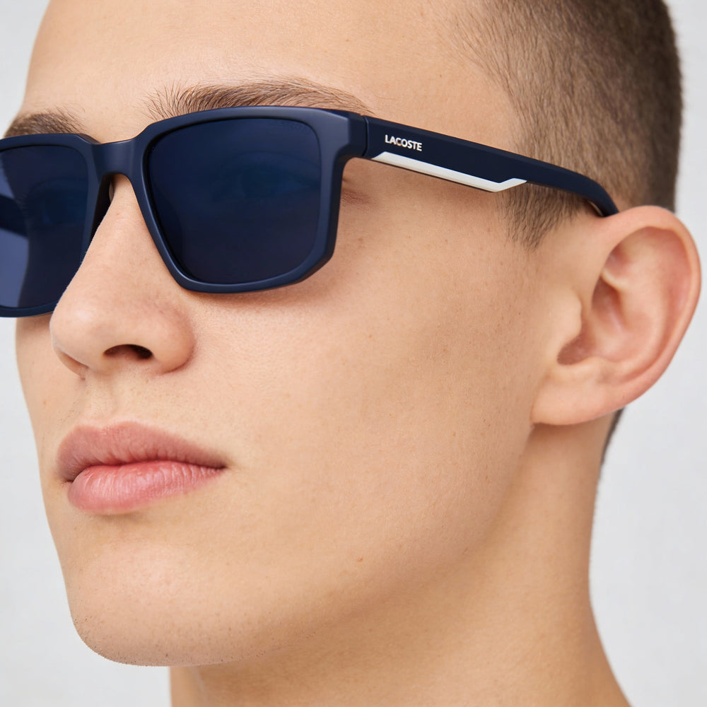Lacoste Modern Unisex Bio Injected Metallic Grey Frame Solid Blue Lenses UV Protection 55mm