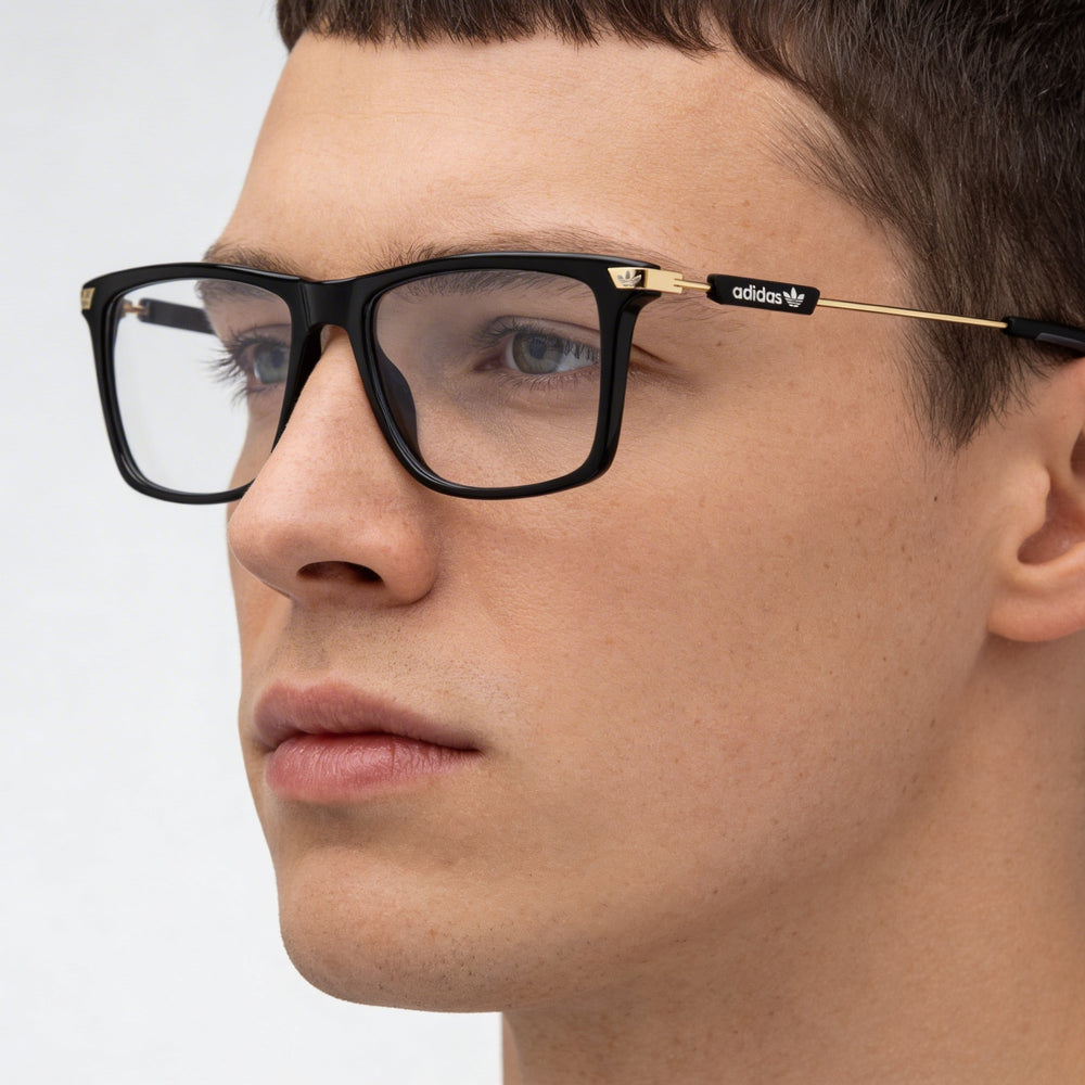 Montura de gafas casual Adidas OR5050 para hombre con construcción de plástico negro brillante de 52 mm
