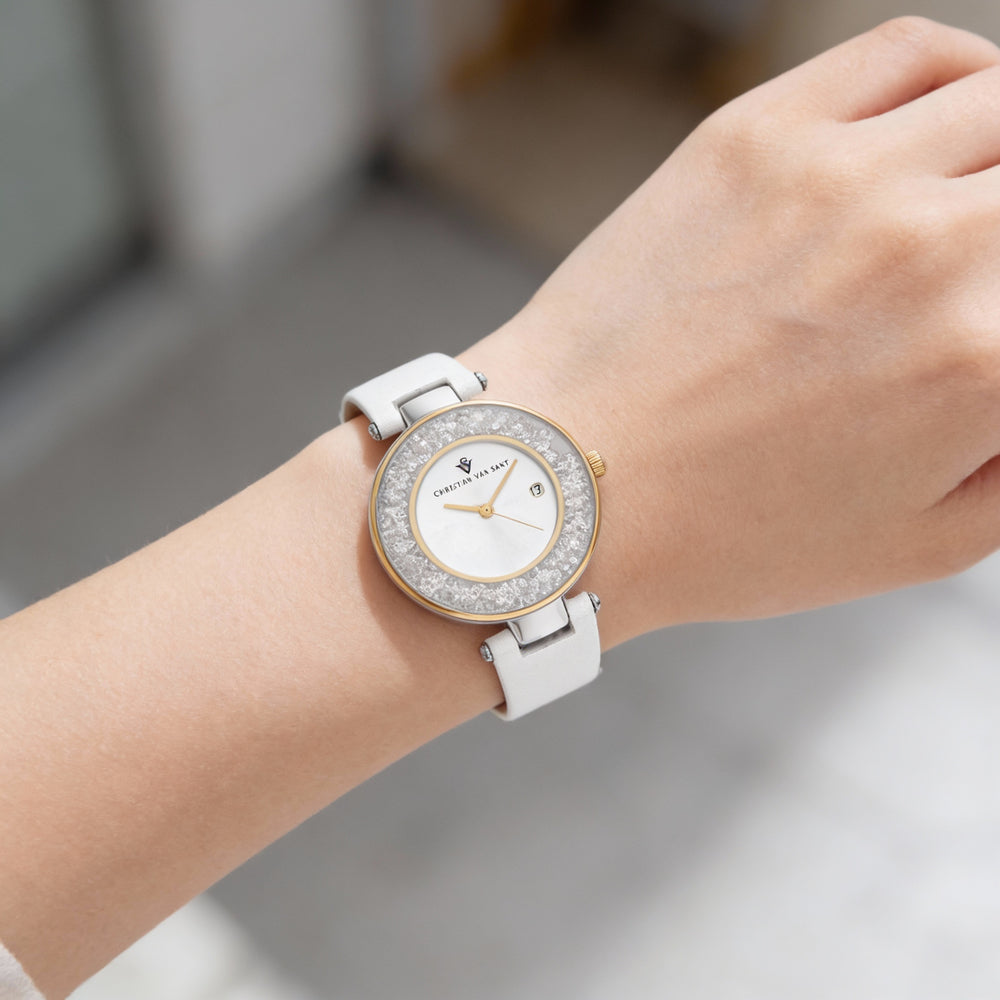 Reloj de cuarzo para mujer de Christian Van Sant con esfera plateada y función de visualización de fecha.