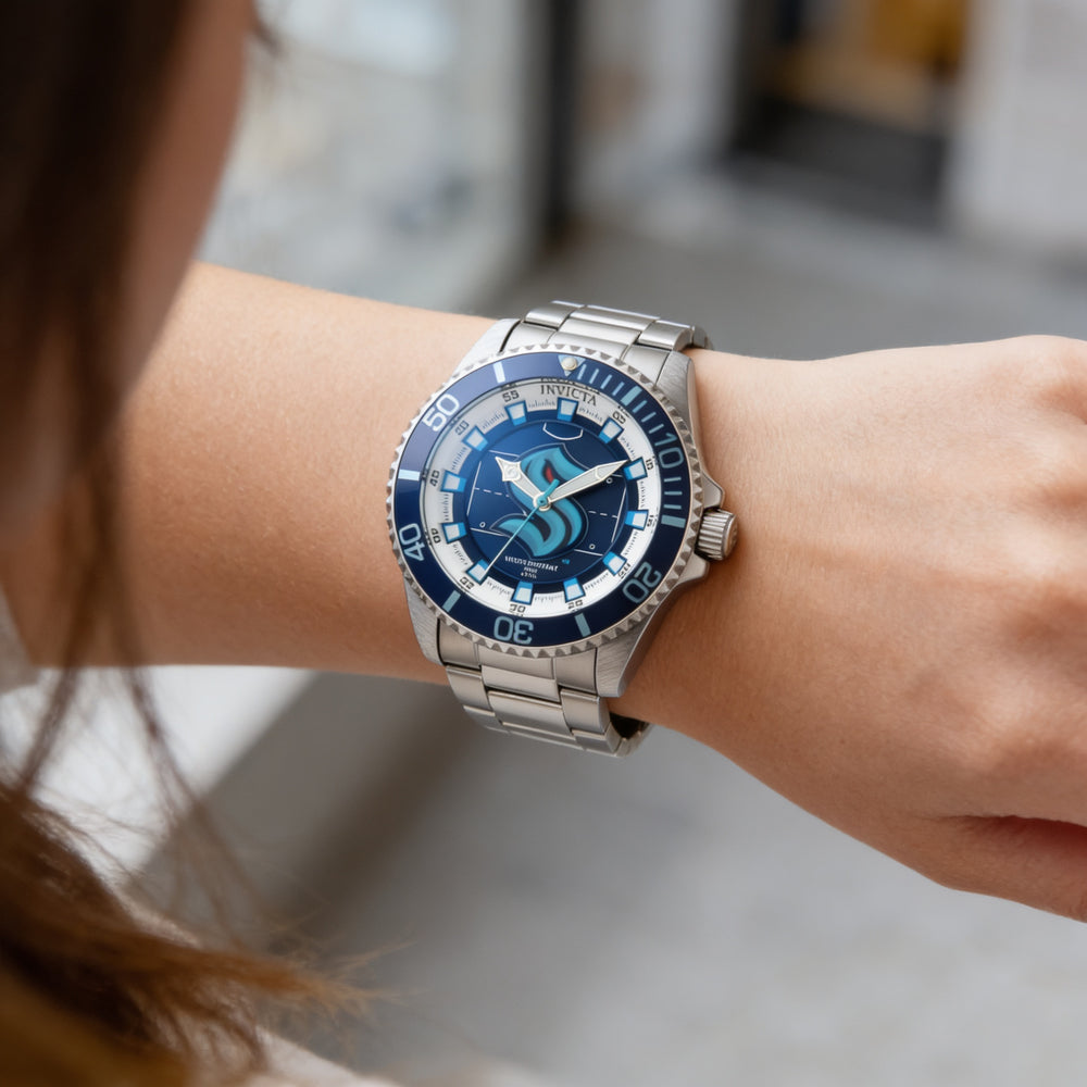 Reloj Invicta NHL IN-42212-AMZUK para mujer, de acero inoxidable plateado y esfera azul, 38 mm