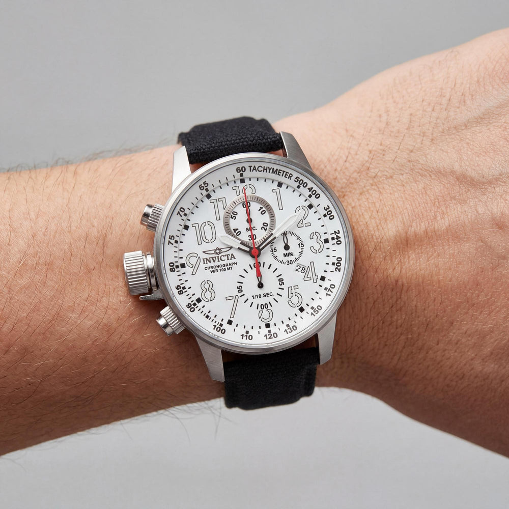 Reloj Invicta para hombre, cronógrafo con corona izquierda, caja de acero inoxidable de 46 mm, esfera blanca, correa de tela y manecillas luminiscentes.