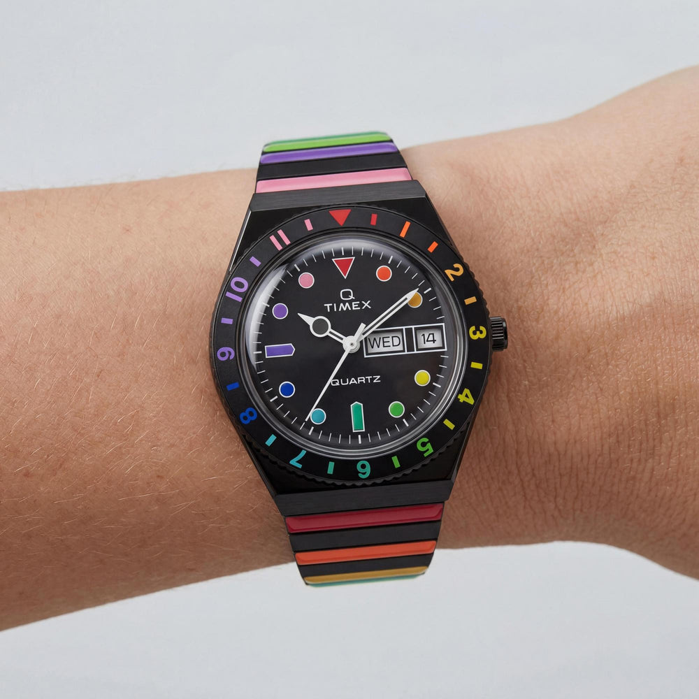 Reloj Timex Q Rainbow de 36 mm para mujer, de acero inoxidable negro, de cuarzo, con cristal mineral, resistente al agua hasta 50 m y correa extensible.