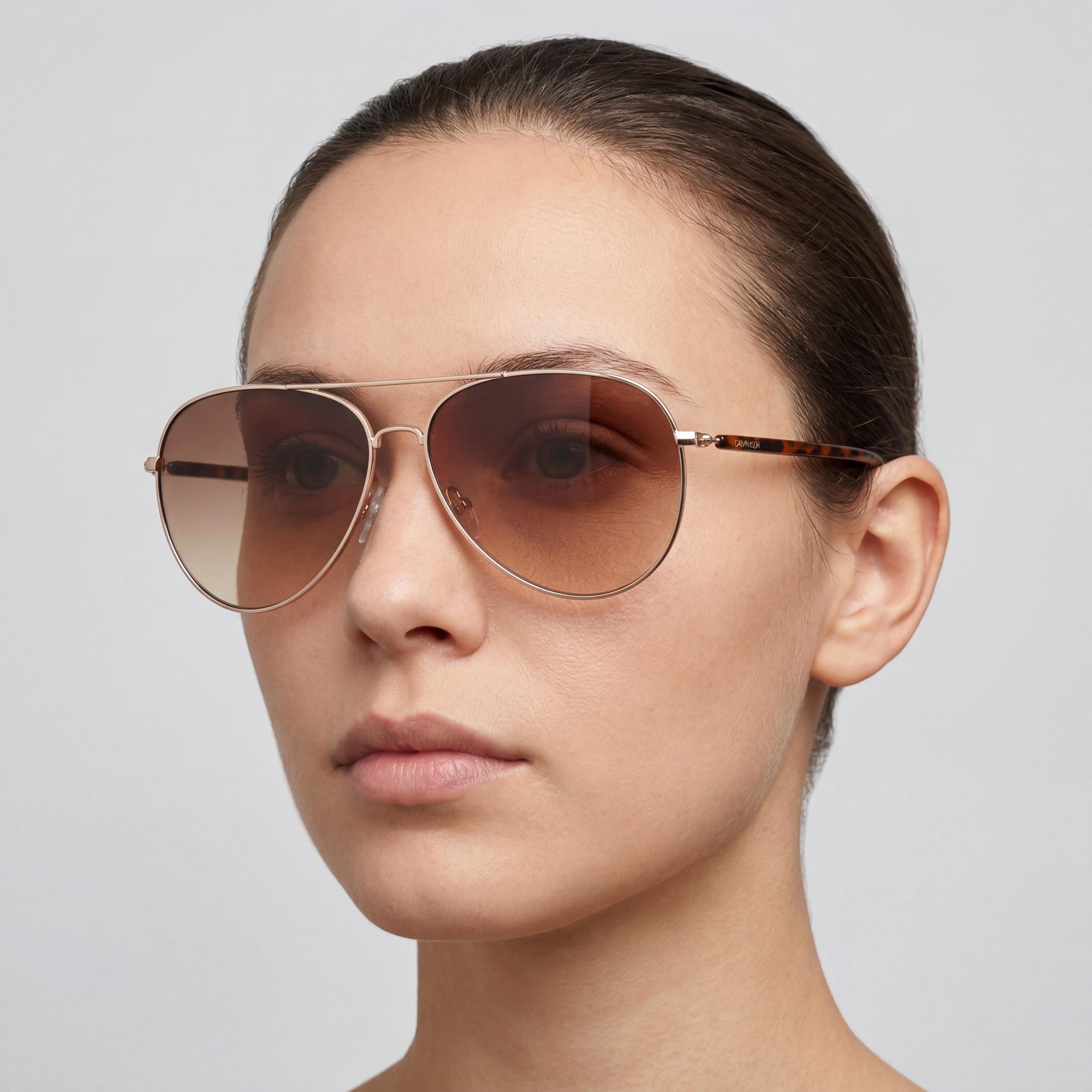 Gafas de sol unisex Calvin Klein Ck19314s de policarbonato con montura dorada y marrón degradado y lentes marrones degradadas de 60 mm, Photo 4