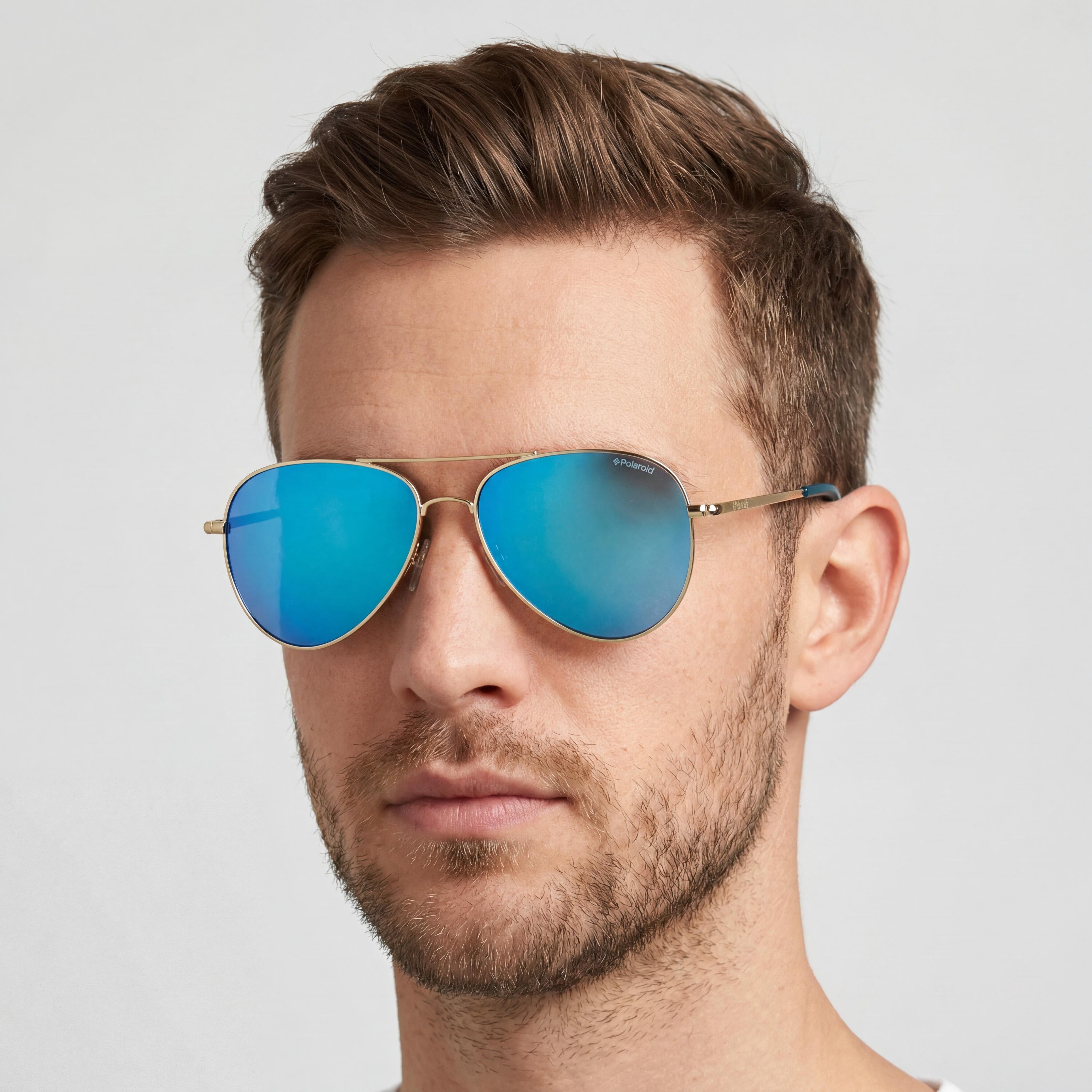 Polaroid Gafas de Sol de Aviador para Hombre, Montura Metálica Dorada, Lentes Antirreflectantes Grises y Azules Espejados, Protección UV 400, Ancho de Lente 54mm, Photo 5