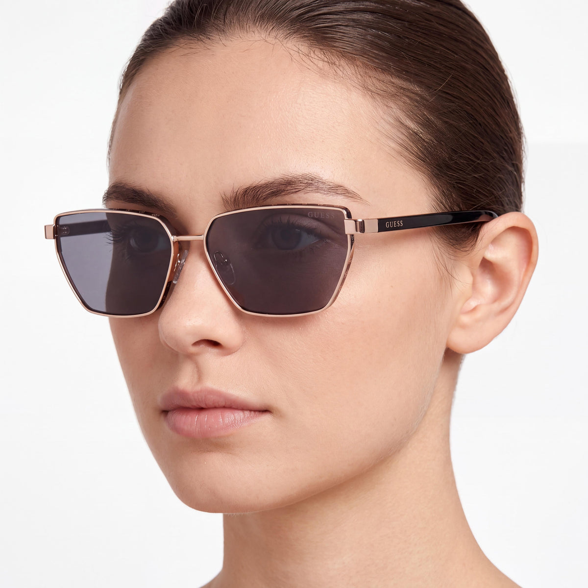 GUESS Women's Narrow Cat-eye Sunglasses, Rose Gold Metal Frame, Smoke Lenses, UV Protection (59mm), Photo 3