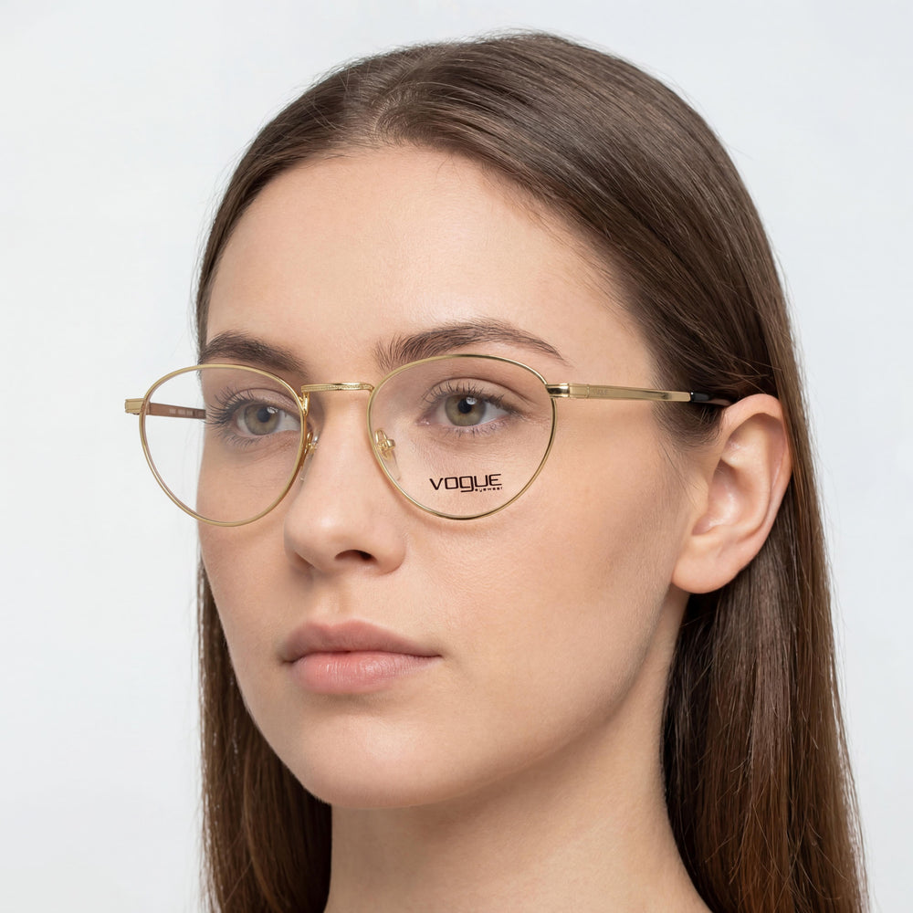 Vogue VO 4084 Round Eyeglasses Women — side view, Gold Plastic temples
